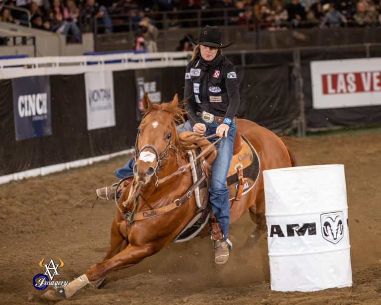 Lacinda Rose turns the second barrel on her horse Real Deal at a rodeo.