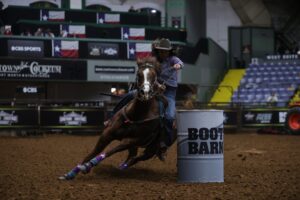 Stephanie Fryar barrel racing at WCRA rodeo.