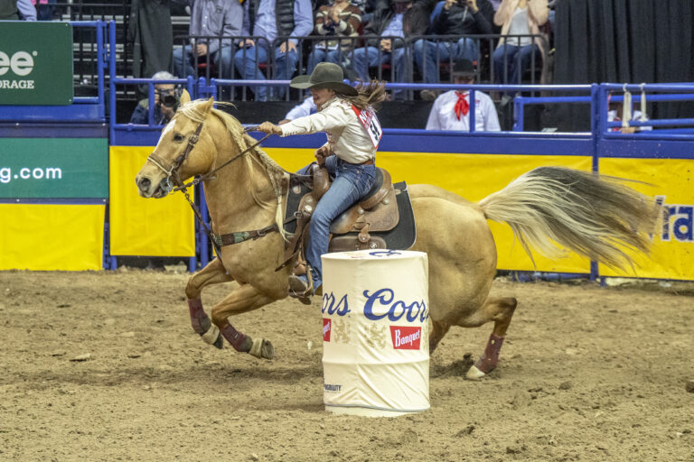 Hailey Kinsel and Sister barrel racing at the 2022 NFR.