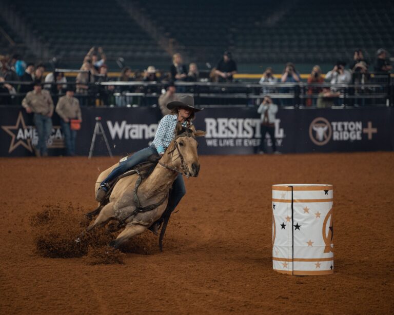 Tamara Barnhart turns a barrel at The American Rodeo.