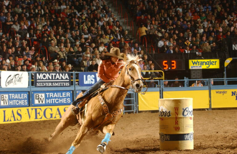 Brittany Pozzi Tonozzi and Duke turn the second barrel at the 2009 NFR.