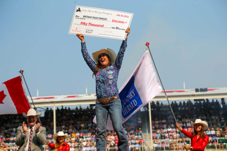 Brittany Pozzi Tonozzi poses with $50,000 check