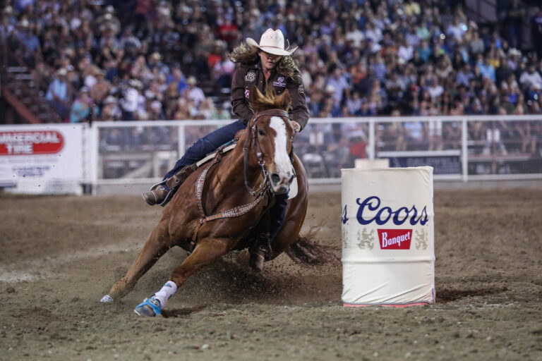 Brittany Pozzi Tonozzi and Benny barrel racing