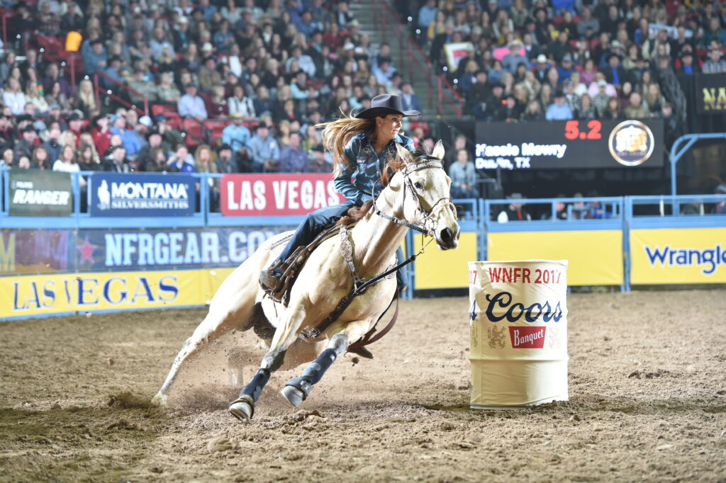 Kassie Mowry and FireWaterMakesMeHappy barrel racing at NFR 2017