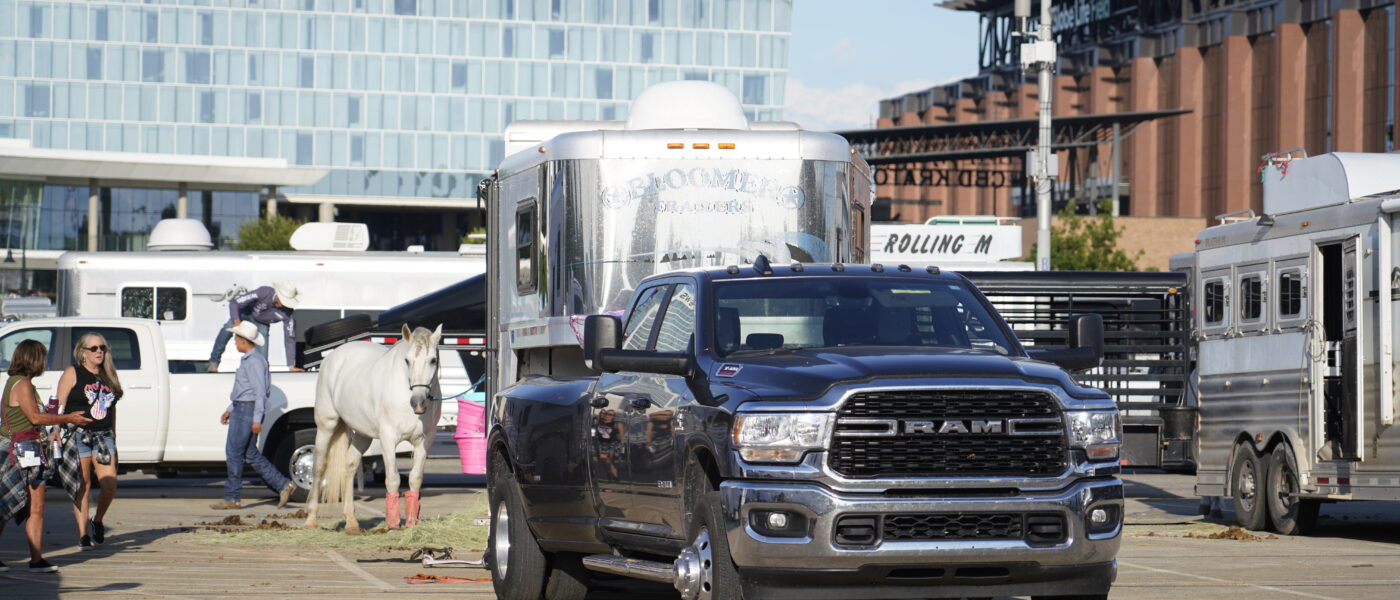 Truck and trailer with horse at rodeo