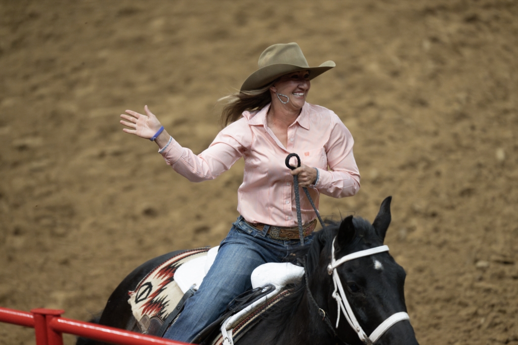 Katelyn Scott victory lap waving at San Antonio Stock Show & Rodeo crowd