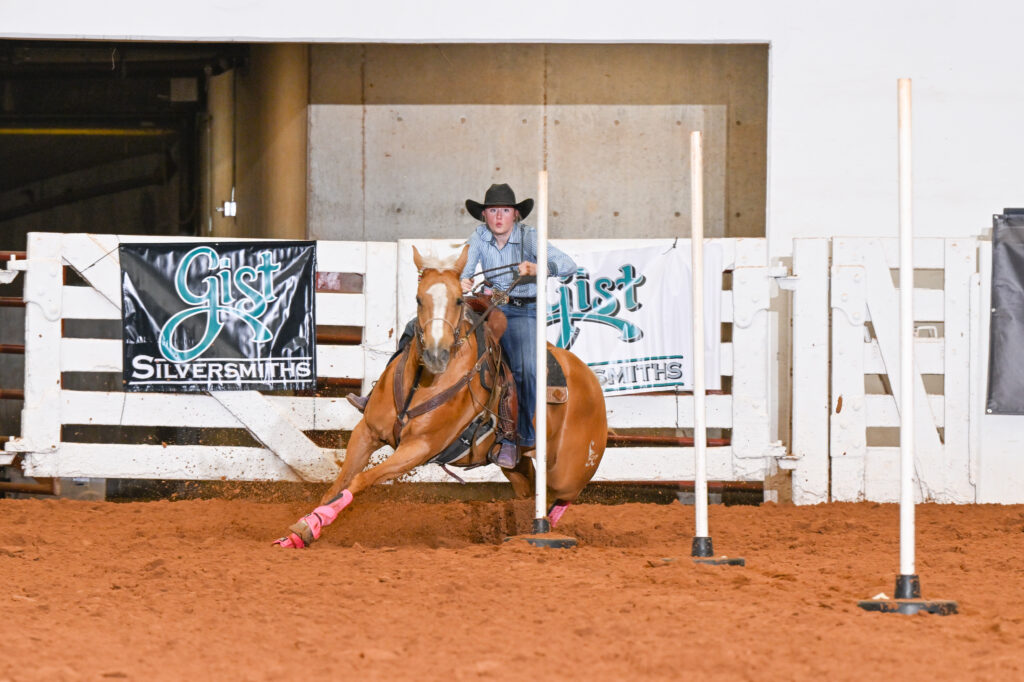 Merrick Moyer and French This Redneck turning the first pole.