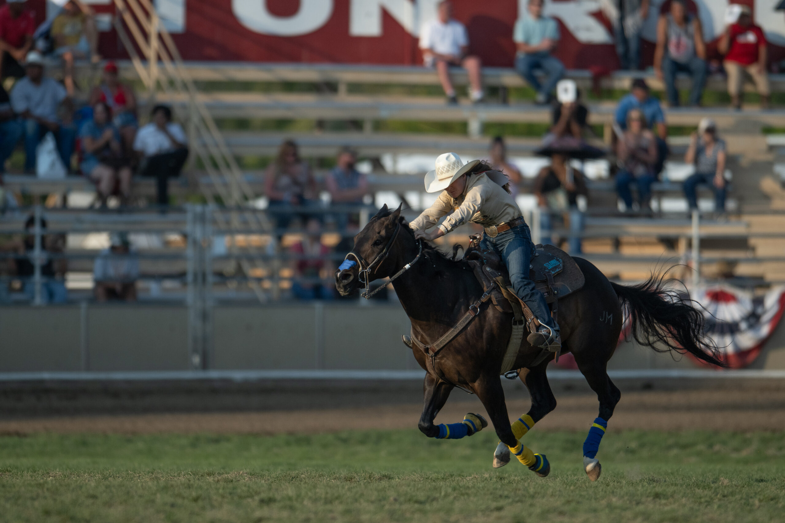 Tayla Moeykens runs across the Pendleton Round-Up Grass on her horse,Lizard.