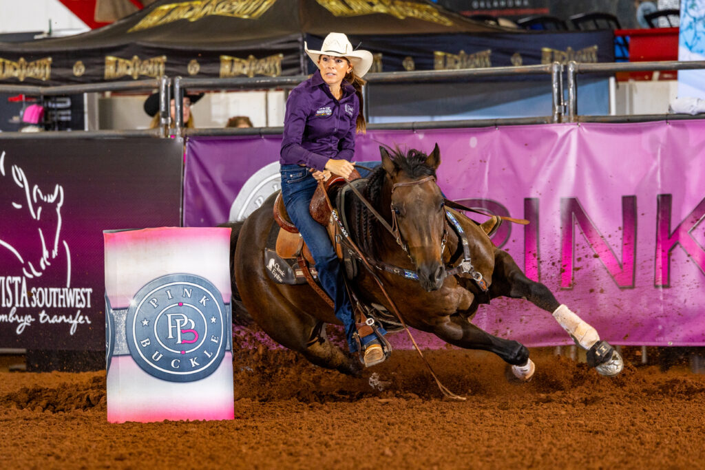 Kassie Mowry and Jarvis turn a barrel