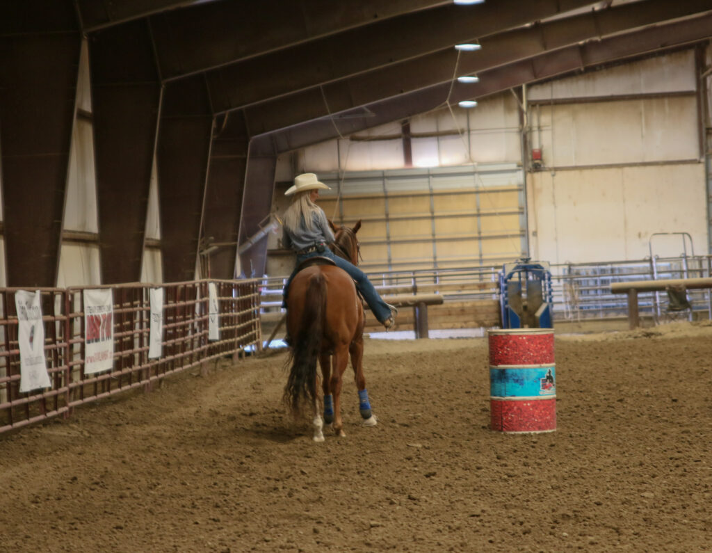 Amy turns the barrel on her horse
