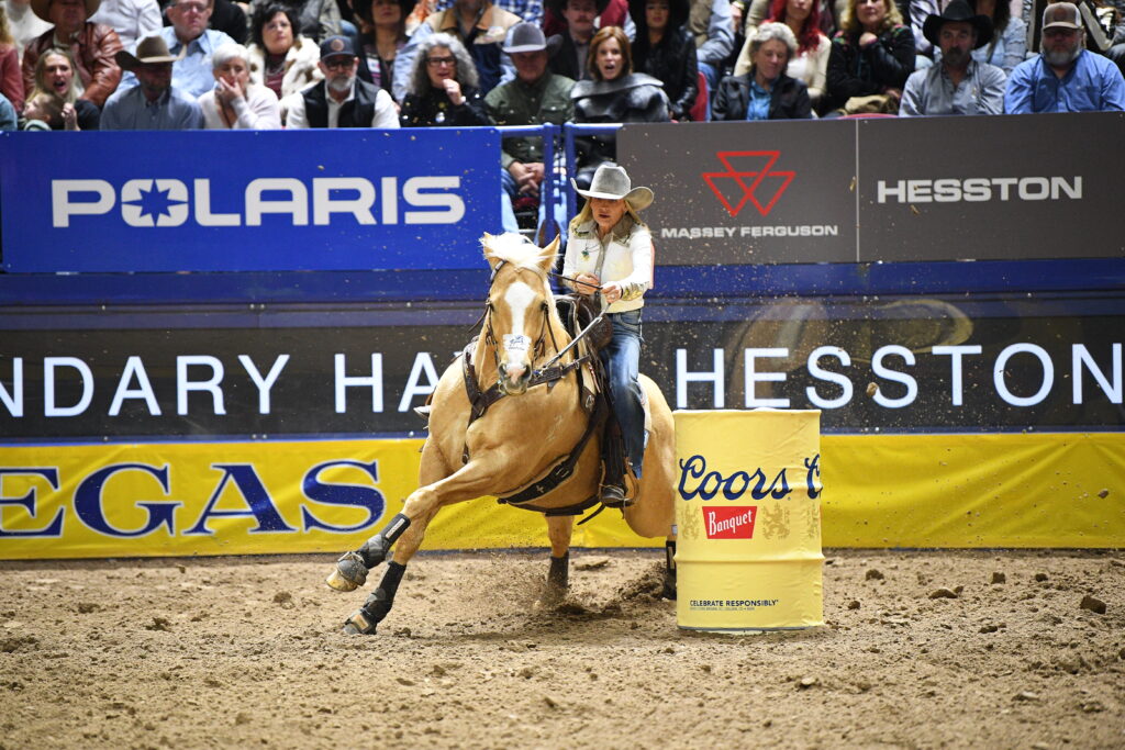 Carlee Otero AM Regina George turn a barrel at NFR