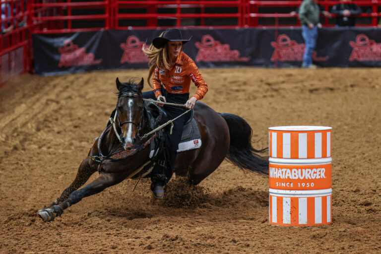 Emily Beisel turns a barrel on Liza in San Antonio