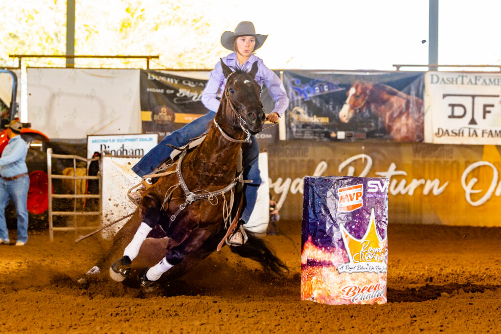 Payton Johnson turns a sparkly barrel on her futurity horse