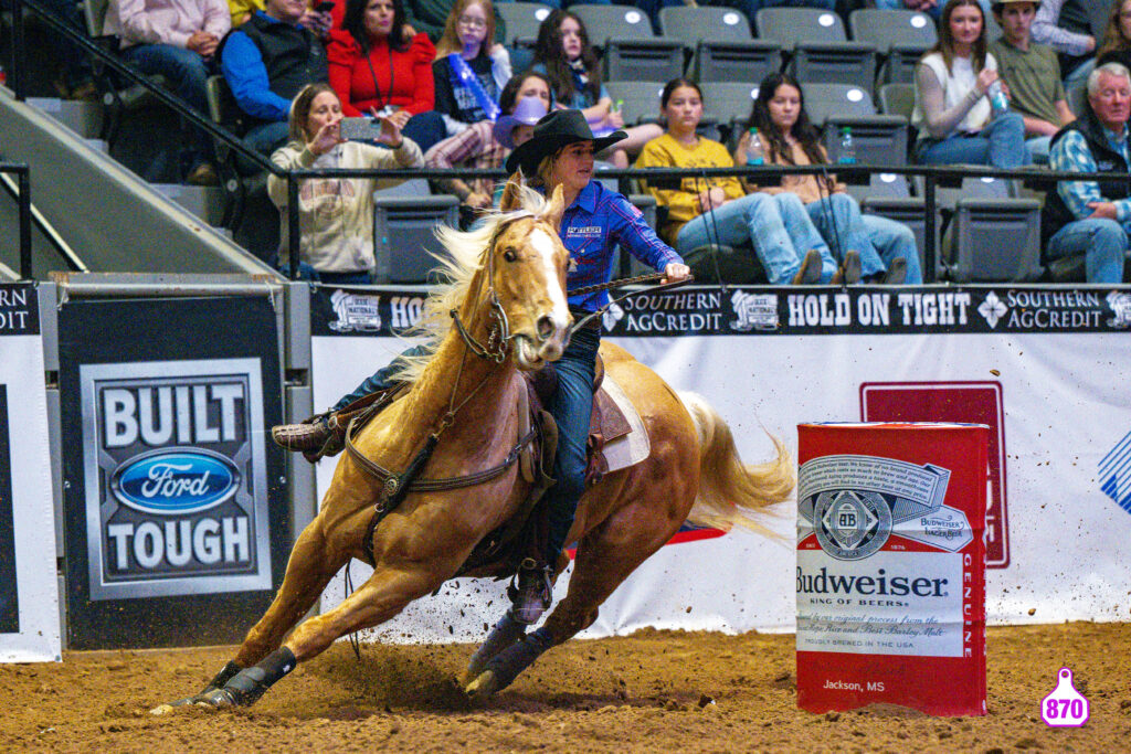 Josey Murphy and Mikey turn a barrel at the Dixie National