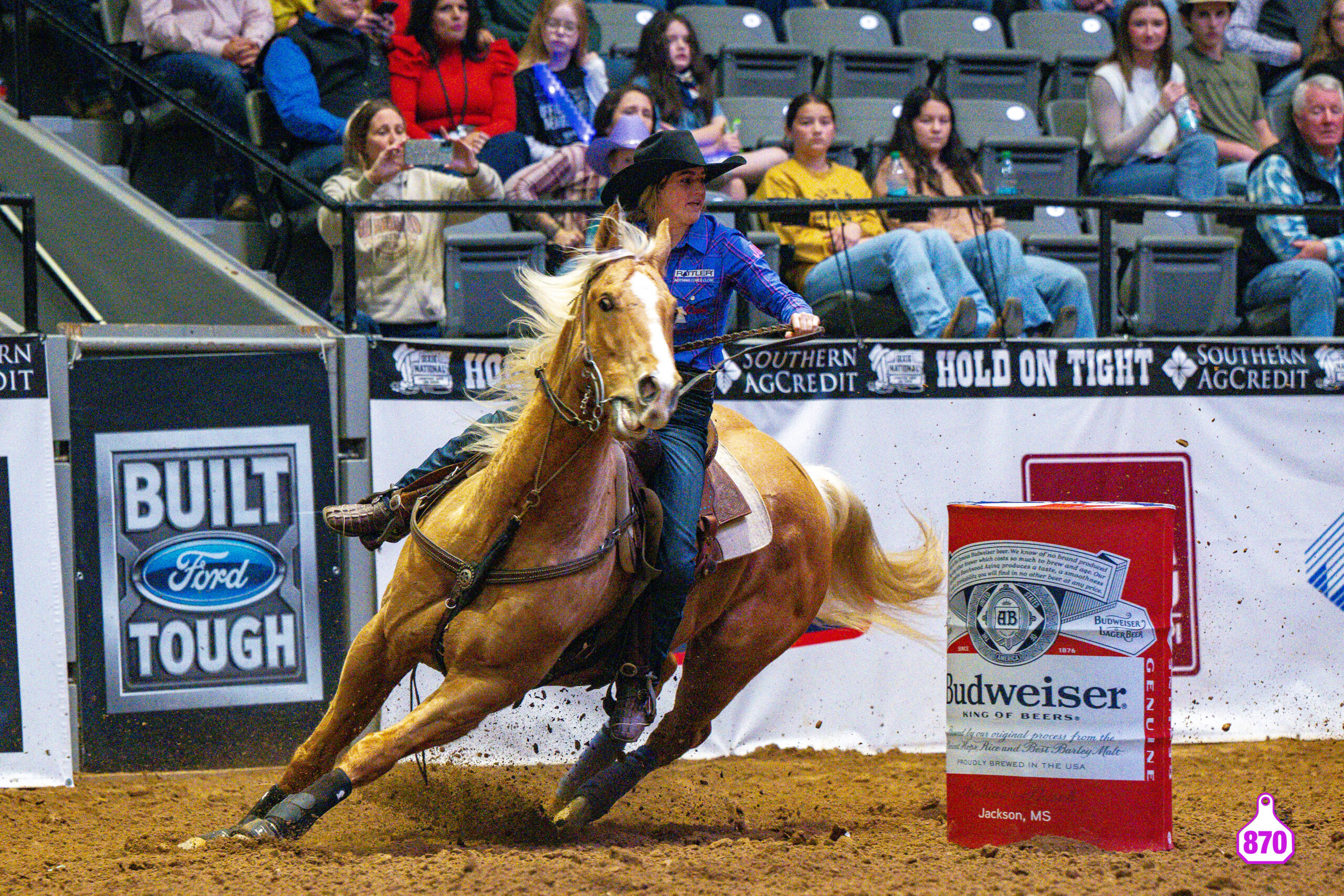 Josey Murphy and Mikey turn a barrel at the Dixie National