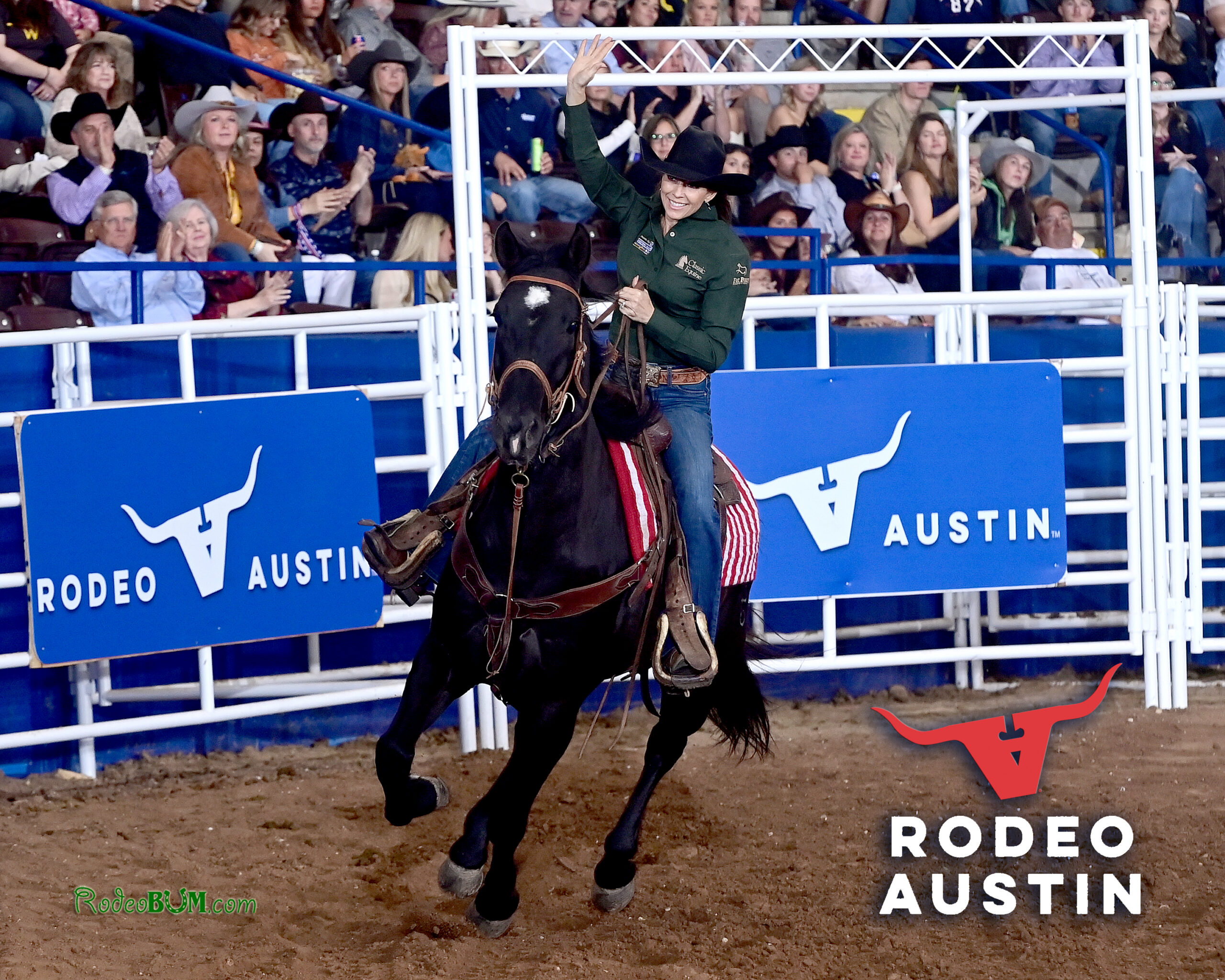 Kassie Mowry waves to the Austin crowd during a victory lap