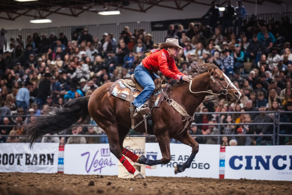 Taylor Jane-Gardner rides her red horse across the timer line