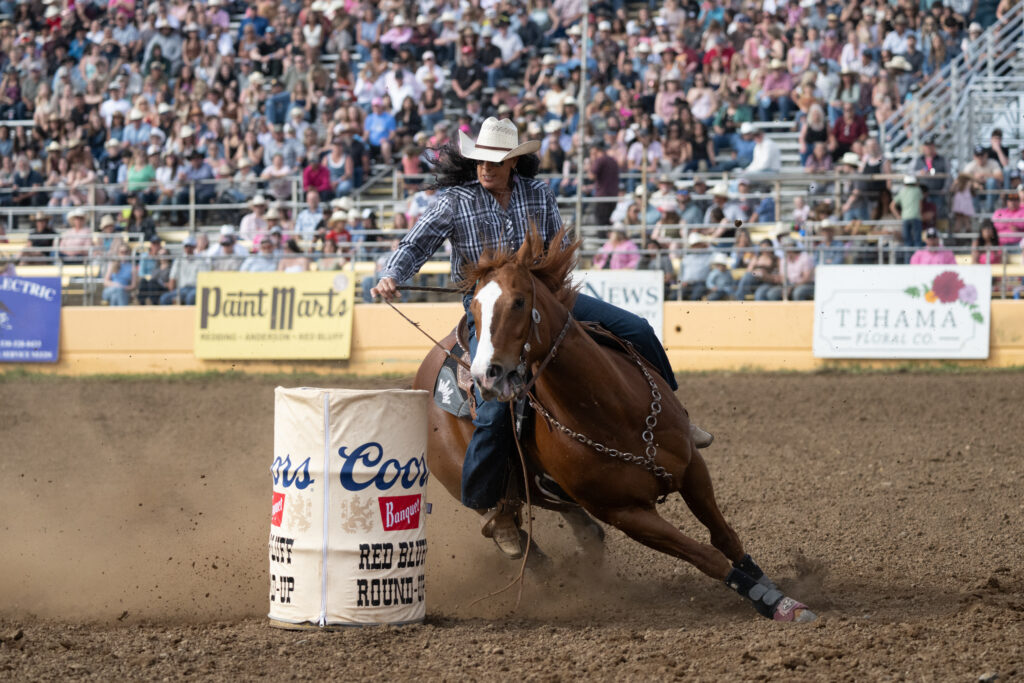 Kathy Petska slides around a barrel in Red Bluff on her horse