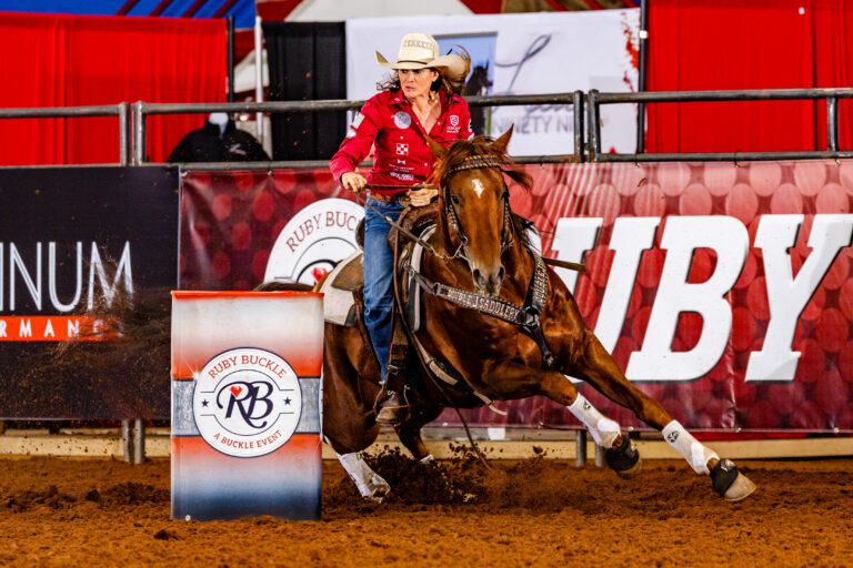 Brittany turns a barrel on her stallion