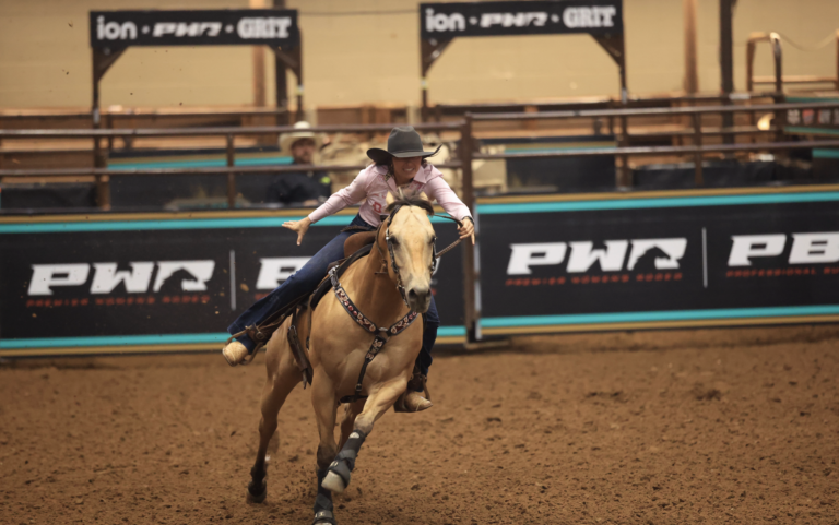 Kappie Bryant runs to the timer line on her horse