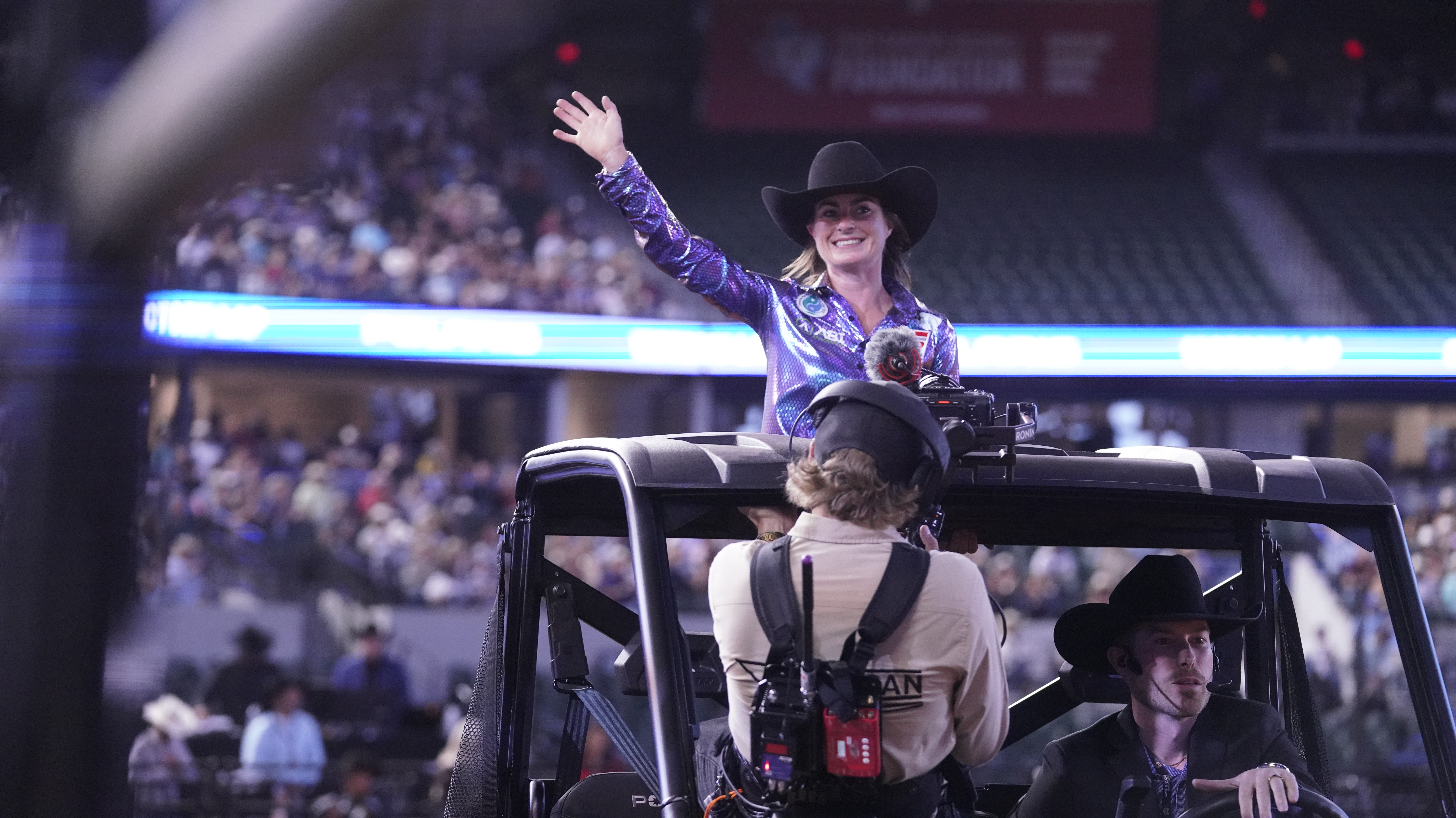 Hayle Stillwell waves as she takes her victory lap at The American