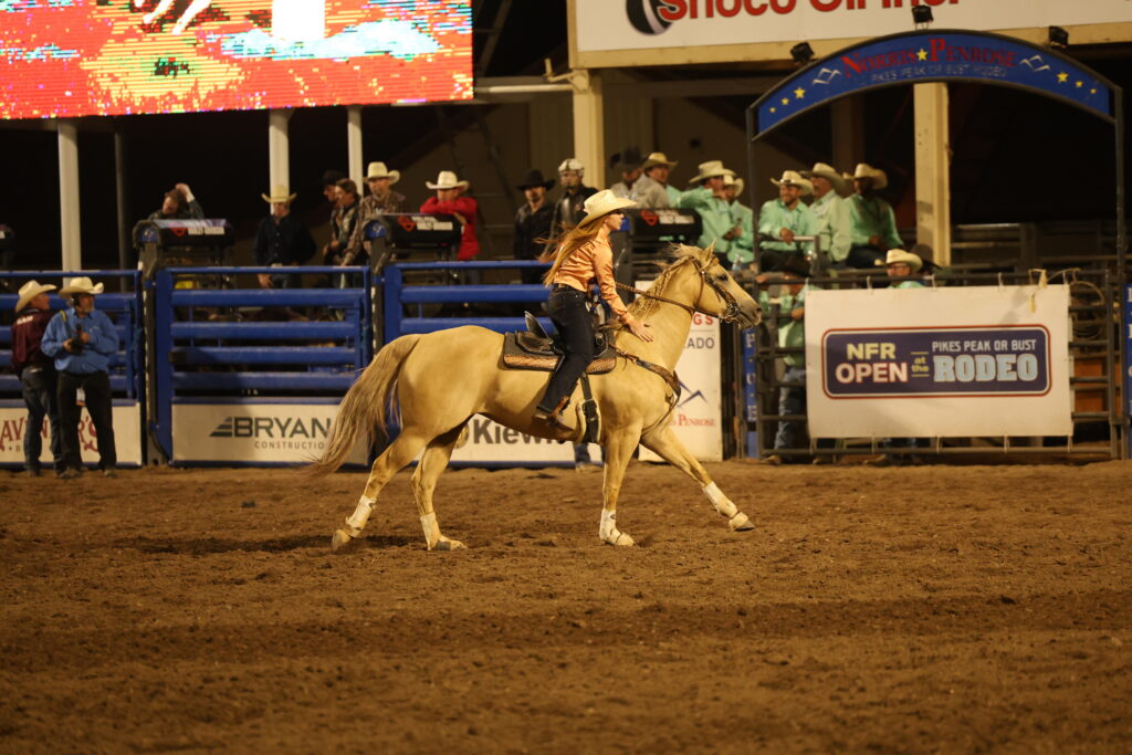 Emily Beisel pets her horse