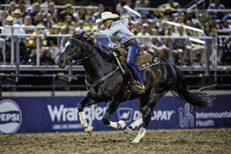 Lisa Lockhart races across the finish line on her horse