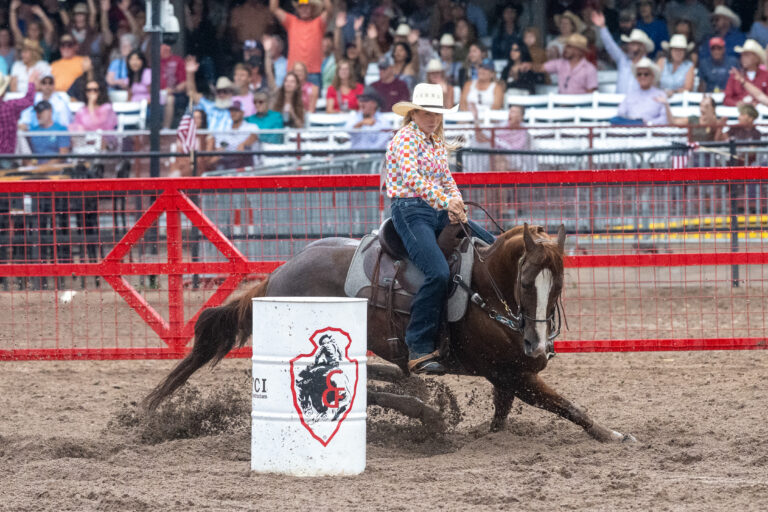 Steely Steiner turns a barrel on her horse