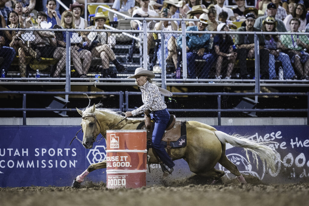 Kariann Cross turns a barrel on her yellow horse at Days of '47