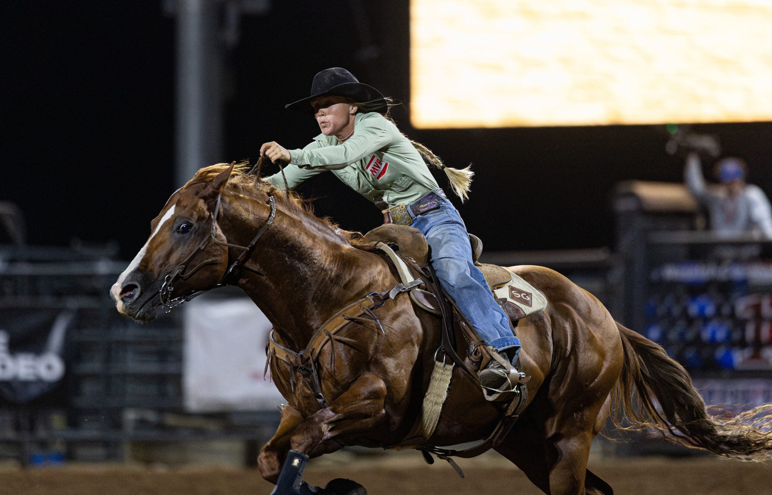 Sydney Graham turns a barrel on her stallion, "Trump"