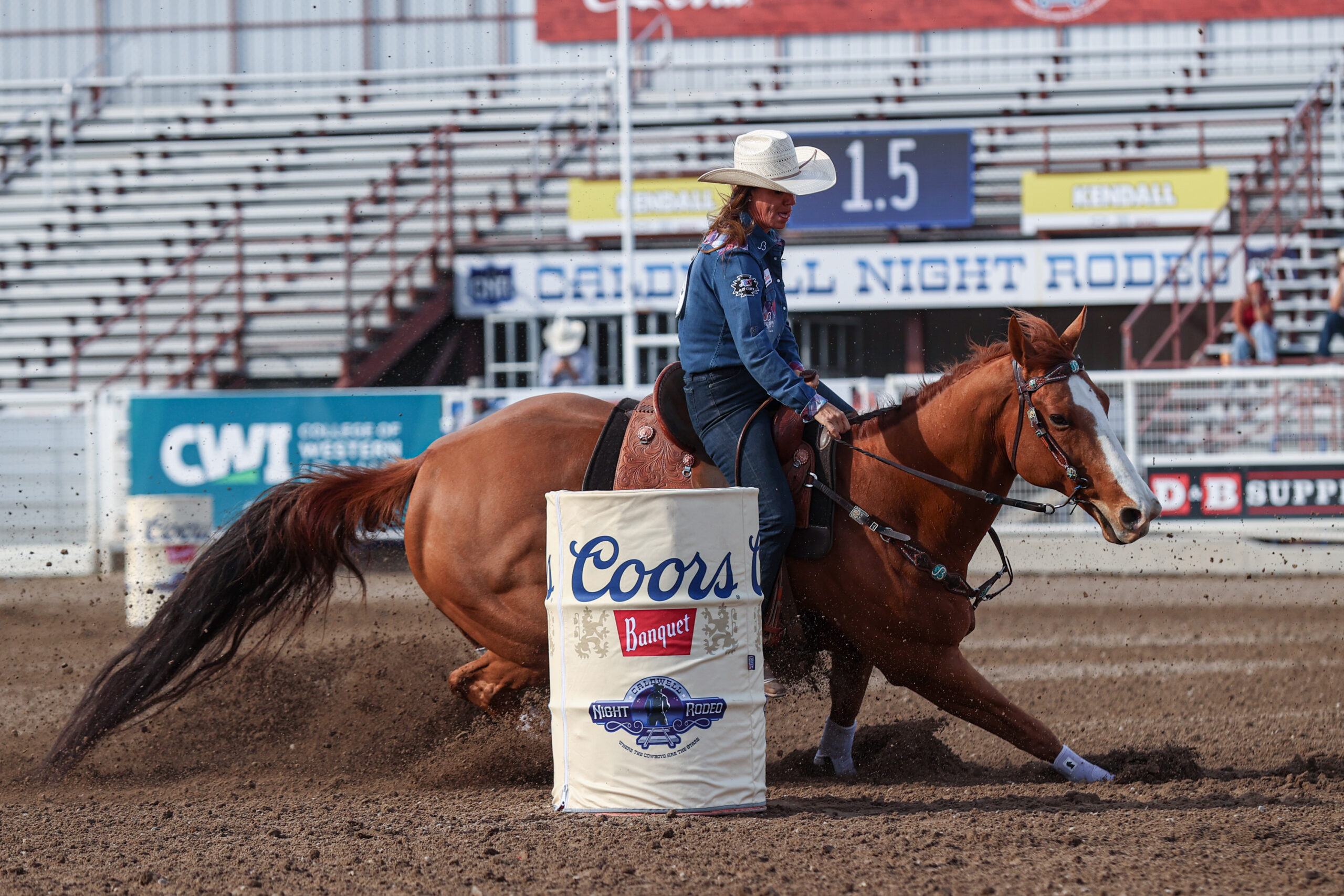 Andrea Busby turns on a red horse at Caldwell