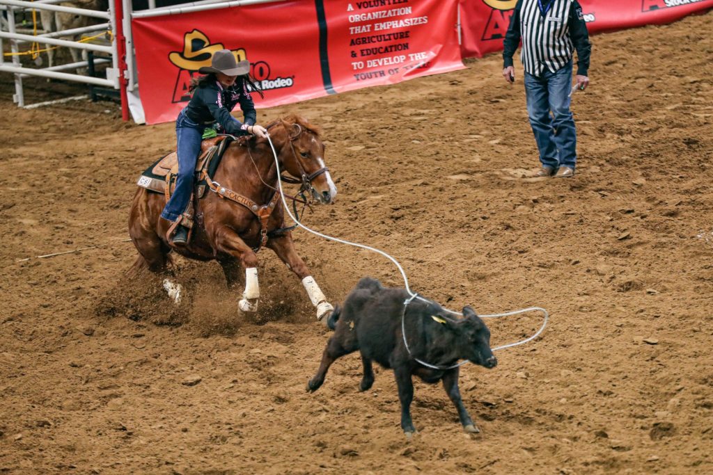 Madison Outhier ropes a calf in breakaway roping at San Antonio.