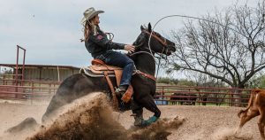 Lari Dee Guy ropes a calf