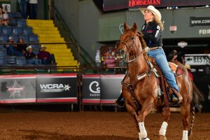 Jackie Crawford rides out of the arena after winning the 2023 WRWC heeling title.