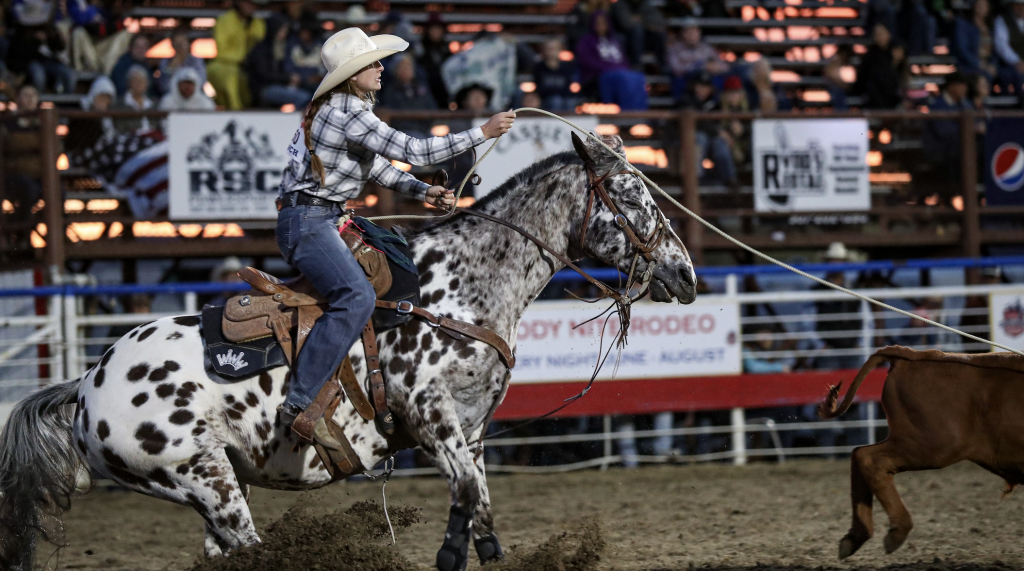 McKenna Hickston ropes her calf in Cody, Wyoming