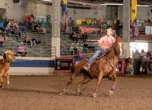 Allison Noble competes at the daddy team roping