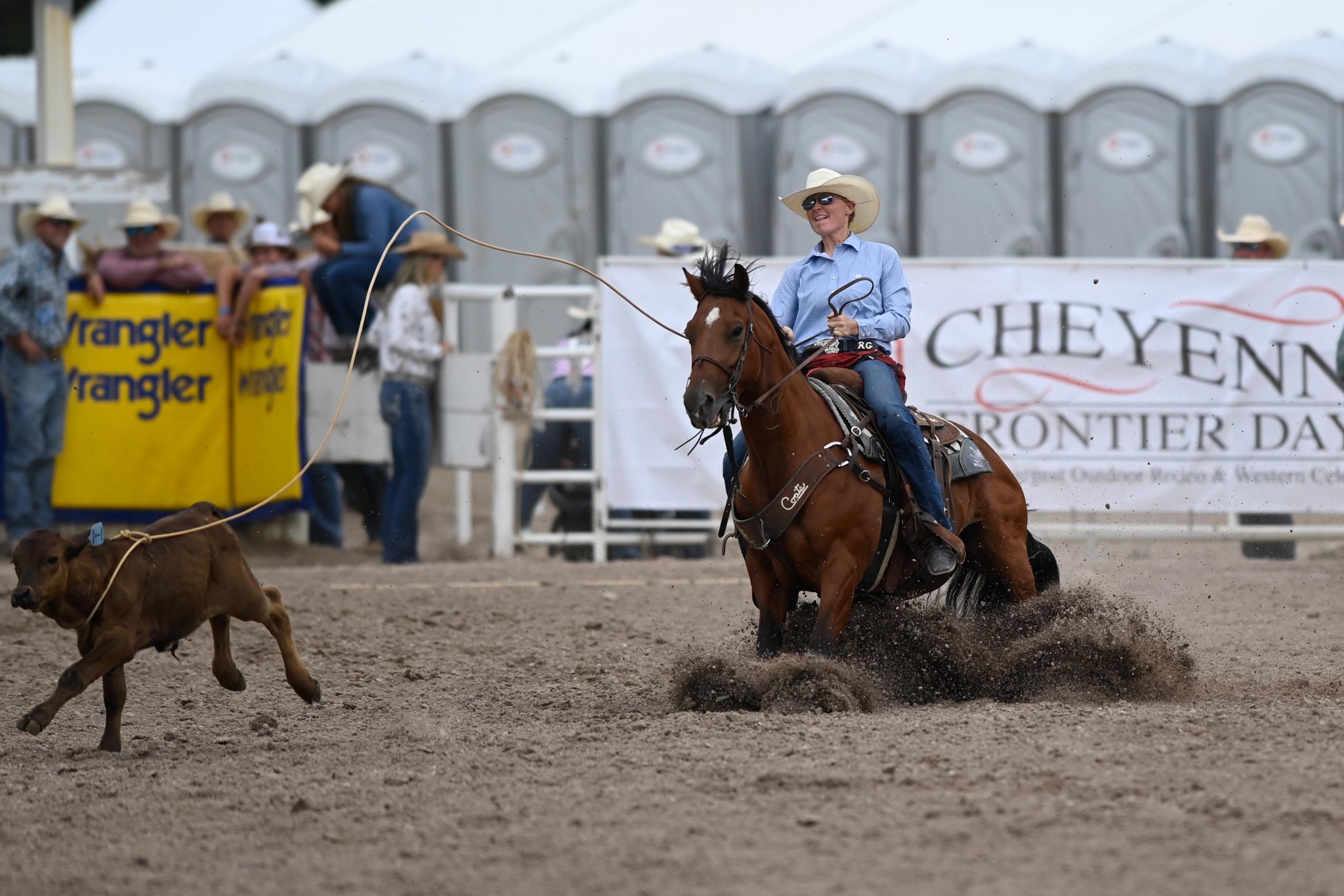 Rylee George ropes her calf at Cheyenne Frontier Days
