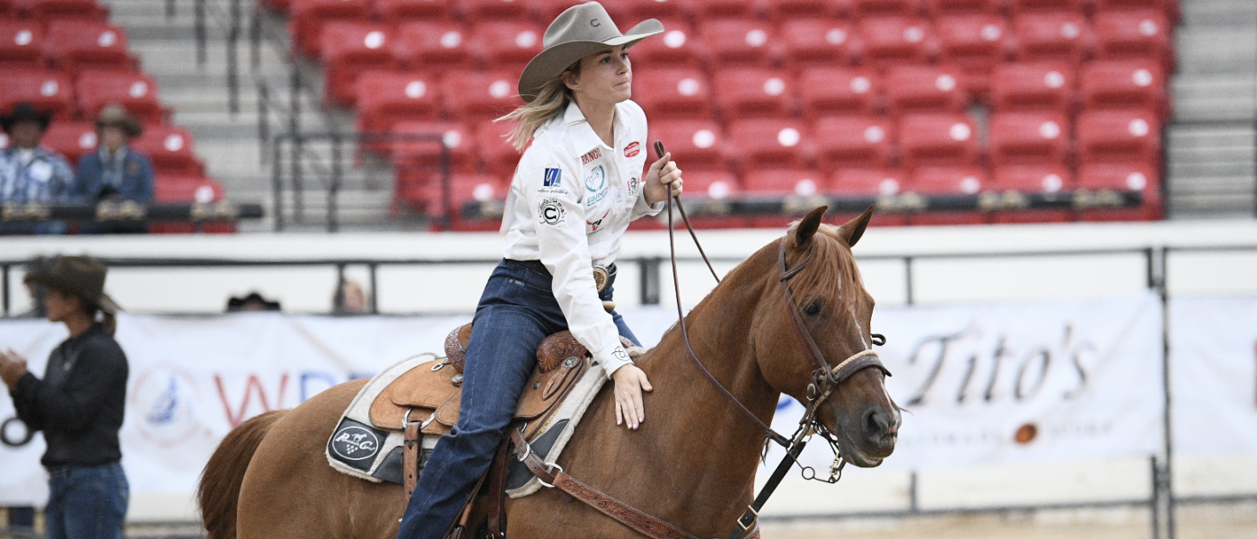 Cheyenne McCartney pats "Gus" following a 2.1-second run in Round 9 that further sealed her average championship.