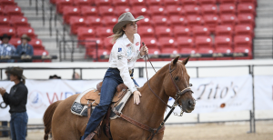 Cheyenne McCartney pats "Gus" following a 2.1-second run in Round 9 that further sealed her average championship.