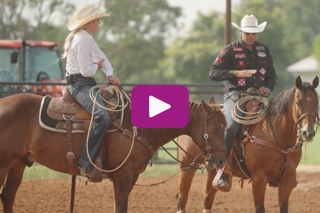 Sarah Angelon and Shad Mayfield have a conversation while riding horses. 