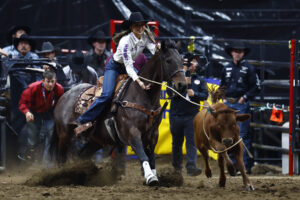 Mary Auclair breakaway roping at the 2024 Canadian Finals Rodeo.