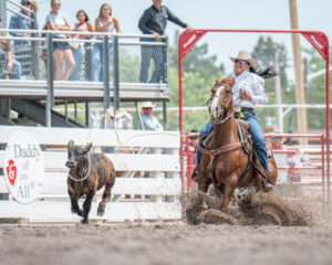 Danielle Lowman from Gilbert, Arizona competes in the Breakaway Roping finals at Cheyenne Frontier Days in Cheyenne on Sunday, July 27, 2025. Lowman won the event, roping her calf in 4.3 seconds.