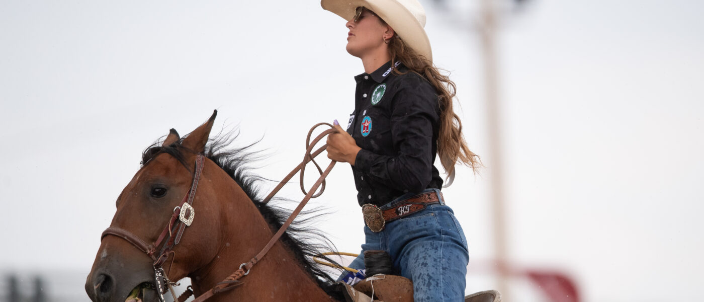 Haiden Thompson rides out of the arena at Cheyenne Frontier Days on gelding "Tom."