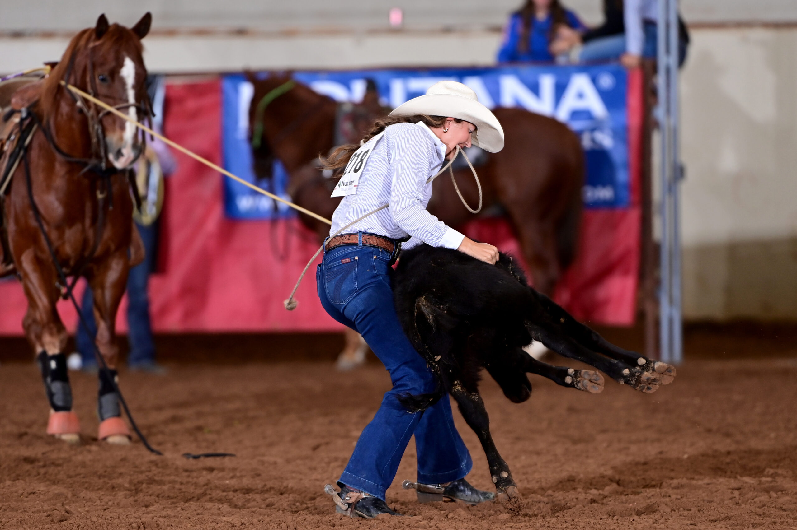 Haiden Thompson flanks a calf in the tie-down roping at the 2025 WPRA Finals on her way to a World Title in the event.