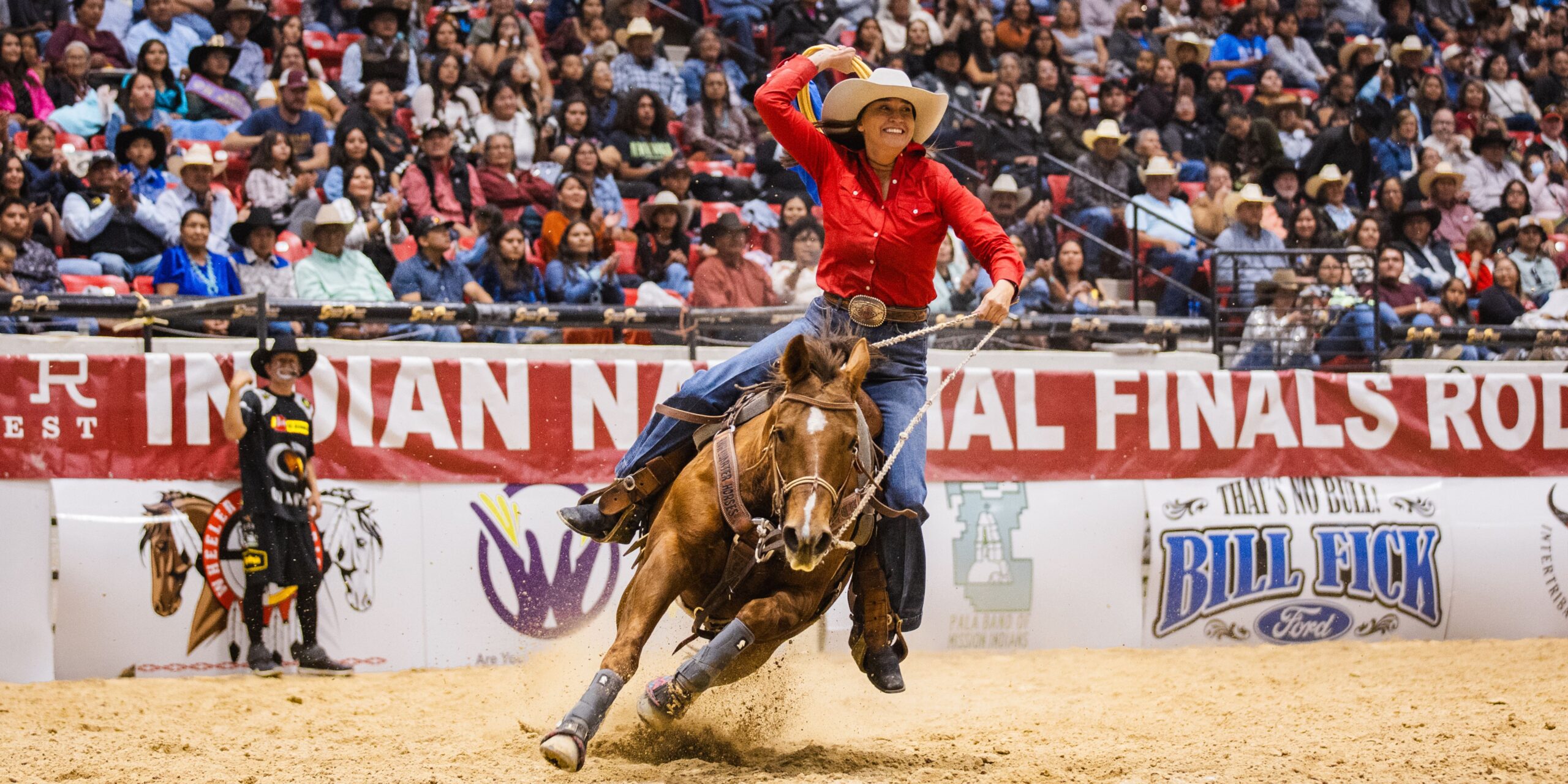 Megan Lunak and "Cricket" take a lap around the arena after her 2025 INFR win.