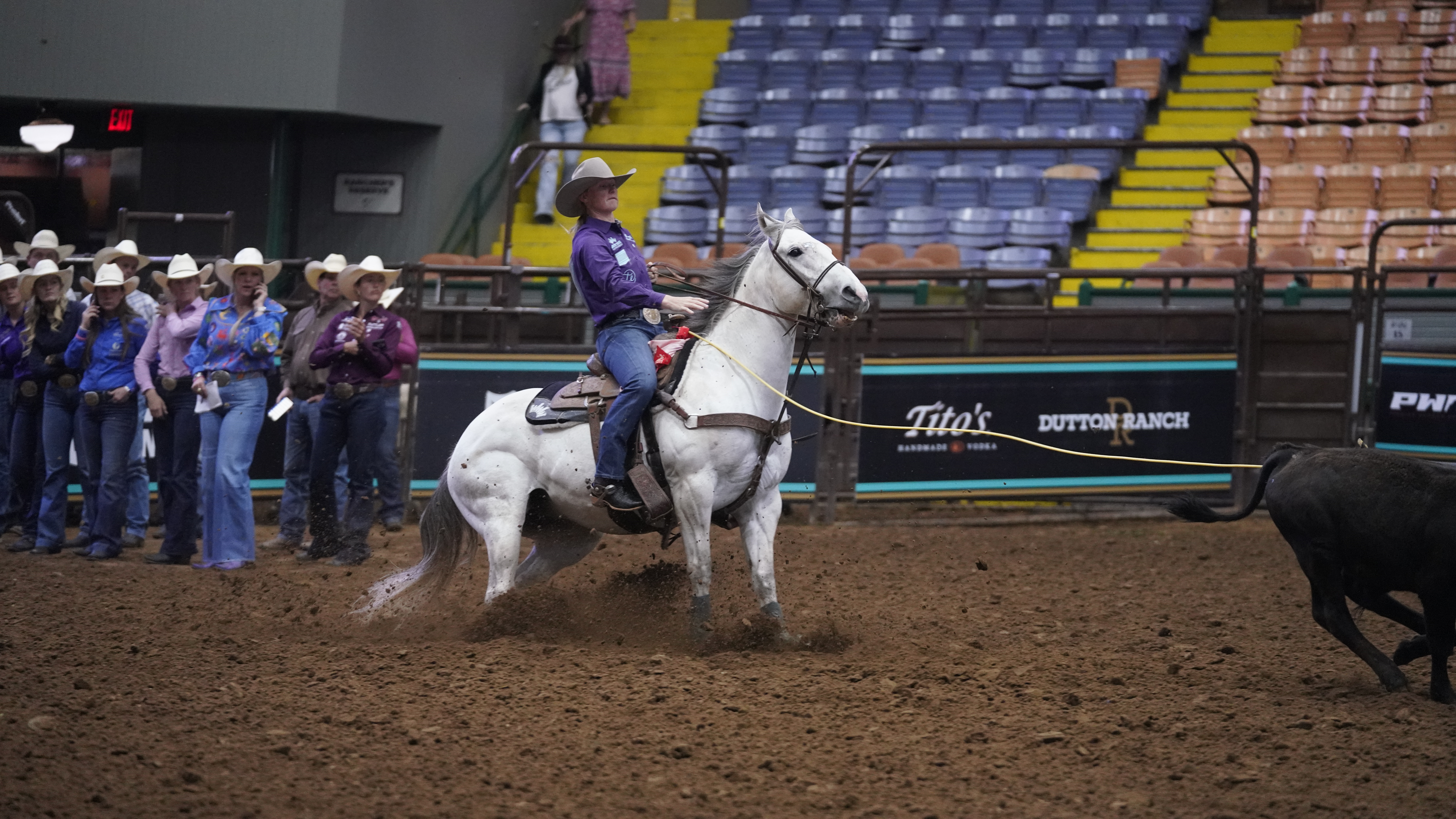 Rylee George ropes a calf at Cowtown Coliseum
