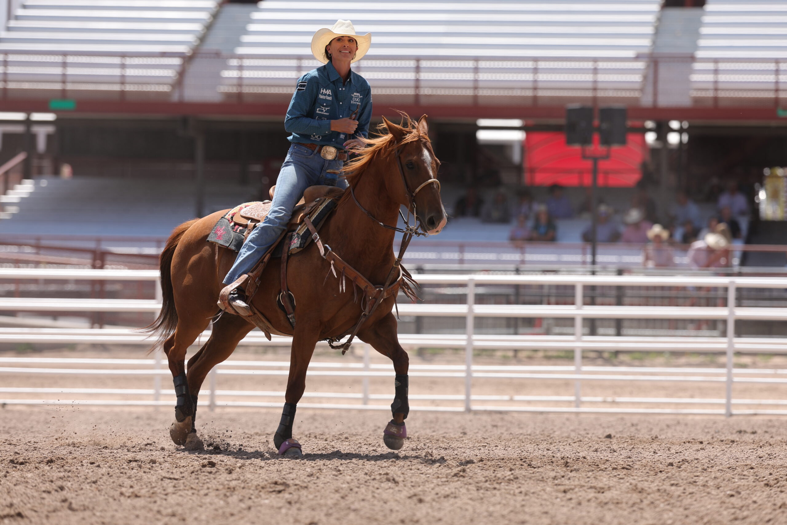 Joey Williams after roping her calf at Cheyenne Frontier Days 2026 to win her first set
