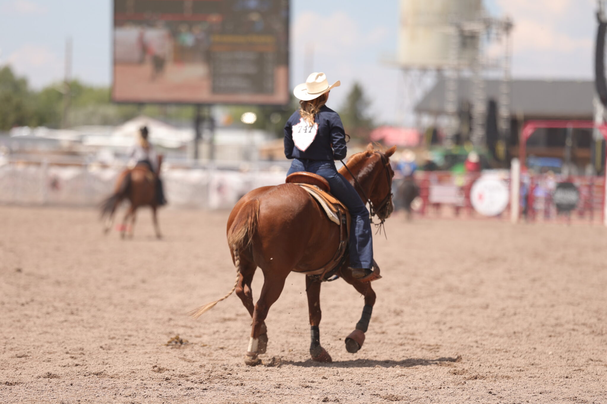 Cheyanne McCartney riding out of the arena after she wins her semifinals set with a 5.1