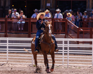 Cheyanne McCartney and horse Teddy riding out of the arena after goign 4.3 to win cheyenne frontier days