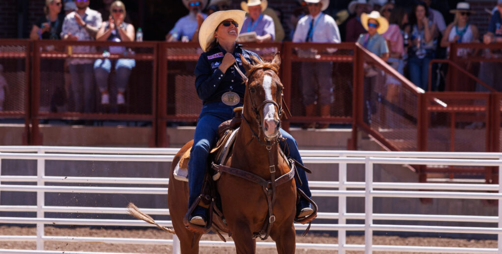 Cheyanne McCartney and horse Teddy riding out of the arena after goign 4.3 to win cheyenne frontier days